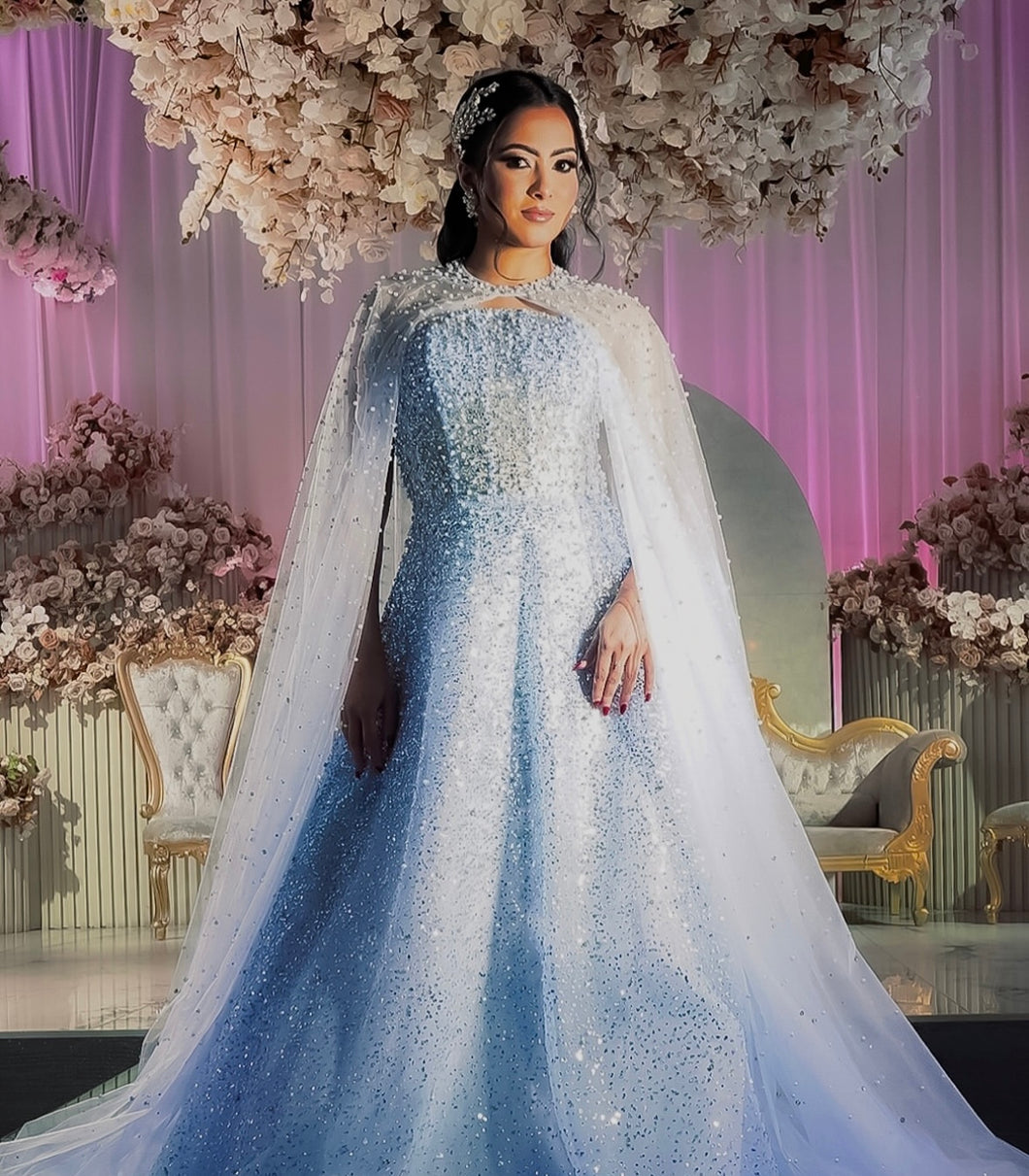 Blue embellished dress with cape